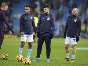 Manchester City's Kevin De Bruyne, Raheem Sterling, Sergio Aguero and David Silva, from left to right, warm up before the English Premier League soccer match between Manchester City and Newcastle United at the Etihad Stadium in Manchester, England, Saturday, Jan. 20, 2018.