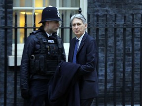Britain's Chancellor of the Exchequer Philip Hammond arrives to attend a cabinet meeting at 10 Downing Street, the first following a reshuffle by Prime Minister Theresa May, in London, Tuesday, Jan. 9, 2018.