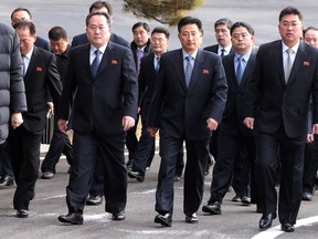 The head of North Korean delegation Ri Son Gwon, second from left, arrives at the South side for the meeting with South Korea at the Panmunjom in the Demilitarized Zone in Paju, South Korea, Tuesday, Jan. 9, 2018. Senior officials from the rival Koreas said Tuesday they would try to achieve a breakthrough in their long-strained ties as they sat for rare talks at the border to discuss how to cooperate in next month's Winter Olympics in the South and other issues. (Korea Pool via AP)