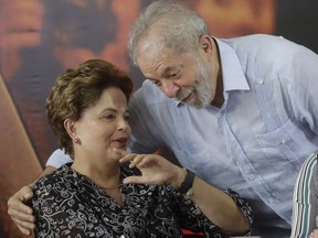 Former Brazilian Presidents, Luiz Inacio Lula da Silva and Dilma Rousseff, attend a meeting with the executive members of the Workers Party, in Sao Paulo, Brazil, Thursday, Jan. 25, 2018. Lula said he will run for president again, even after an appeals court unanimously upheld a graft conviction against him and added years to his prison sentence.