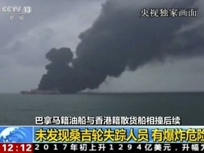 In this image from video run by China's CCTV shows the Panama-registered tanker "Sanchi" is seen ablaze after a collision with a Hong Kong-registered freighter off China's eastern coast, Monday, Jan. 8, 2017. The U.S. Navy has joined the search for 32 crew members missing from the oil tanker that caught fire after colliding with a bulk freighter off China's east coast. (CCTV via AP Video)