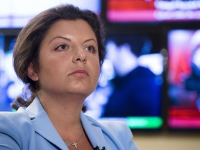 In this photo taken on Friday, Jan. 19, 2018, Margarita Simonyan, the head of the Russian television channel RT, listens to a question during her interview with the Associated Press in Moscow, Russia. Simonyan, the head of Russian television channel RT, which U.S. intelligence agencies allege took part in the campaign to influence last year's presidential election, says that having to register as a foreign agent in the United States is already hurting the Kremlin-funded outlet.