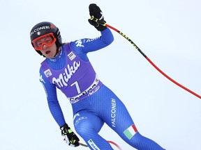 Italy's Sofia Goggia celebrates after completing an alpine ski, women's World Cup downhill, in Cortina D'Ampezzo, Italy, Friday, Jan.19, 2018.