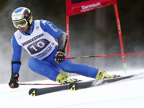 Italy's Manfred Moelgg speeds down the slope during the first run of an alpine ski, men's World Cup giant slalom, in Garmisch Partenkirchen, Germany, Sunday, Jan. 28, 2018.