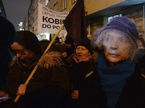 Women march to protest a plan in Poland's parliament to tighten the country's already restrictive abortion laws, in Warsaw, Poland, on Wednesday, Jan. 17, 2017. Similar protests were also held in other Polish cities.