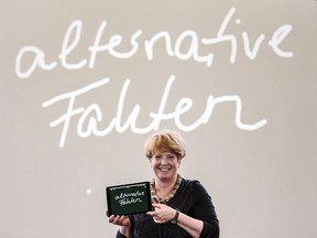 Spokeswoman of the Jury, Nina Janich presents the non-word 2017, 'alternative Fakten' , alternative facts,  in Darmstadt, Germany, Tuesday Jan. 16, 2018. German linguists have declared the phrase "alternative facts," popularized by White House aide Kellyanne Conway, the non-word of 2017. A team of six language experts at Darmstadt University chose "alternative facts" from among 684 suggestions.