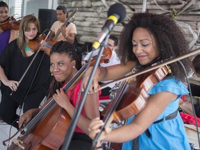 Cuban band Frasis plays after an agreement ceremony between Sony and the Cuban label Egrem in Havana, Cuba, Wednesday, Jan. 24, 2018. Both parties signed a deal to internationally distribute the catalog of Cuba's state-run Egrem Music, giving the US music giant rights to renowned Cuban artists.