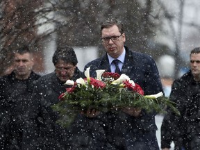 Serbia's President Aleksandar Vucic attends a wreath laying ceremony at the site of the attack where Kosovo Serb politician Oliver Ivanovic was assassinated in the northern, Serb-dominated part of Mitrovica, Kosovo, Saturday, Jan. 20, 2018. Serbia's president is visiting Serb-dominated areas in Kosovo days after a moderate politician was gunned down in an attack that fueled concerns of instability in the volatile Balkans.