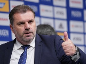 Yokohama F Marinos new head coach Ange Postecoglou of Australia gives a thumbs up after a press conference in Yokohama, near Tokyo, Sunday, Jan. 14, 2018. Former Australia coach Postecoglou was introduced as head coach of the J-League's Yokohama F. Marinos on Sunday.