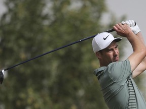 England's Ross Fisher tees off on the 3rd hole during the final round of the Abu Dhabi Championship golf tournament in Abu Dhabi, United Arab Emirates, Sunday, Jan. 21, 2018.