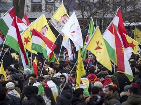 Kurdish immigrants and supporters gather for a rally to protest against a Turkish military operation in a Kurdish enclave in northern Syria. in Cologne, Germany, Saturday, Jan. 27, 2018. Police say some 7,000 protesters are demonstrating in the western German city of Cologne, which is one of the centers of the Kurdish community in Germany.