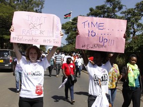 Protesters march along the streets of Nairobi holding placards against the rape allegation by staff of Kenyatta national hospital in Nairobi, Kenya Tuesday, Jan. 23, 2018. Protesters allege it is difficult for victims of sexual assault to go to police, and want swift investigations while demanding changes to make women safe at hospital.