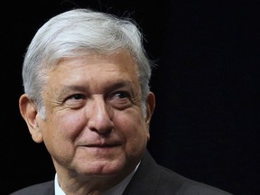 FILE - In this Nov. 20, 2017 file photo, presidential hopeful Andres Manuel Lopez Obrador arrives at the National Auditorium in Mexico City. The early front-runner in Mexico's presidential race proposed on Jan. 4, 2018 to tackle what he calls the root causes of crime and violence if he wins election in July, saying he would make economic development, job creation and education a focus of his administration.