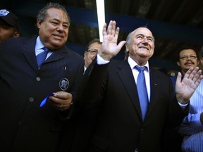 FILE - This April 14, 2011 file photo shows Nicaragua Soccer Federation President Julio Rocha, left, and FIFA President Joseph S. Blatter, at the end of a ceremonial ribbon cutting for the National Soccer Stadium in Managua, Nicaragua. The head of the Nicaraguan Soccer Federation says his predecessor Julio Rocha, who was convicted in the United States in a corruption scandal at the sport's world governing body, FIFA, died on Saturday, Jan. 13, 2018, after an illness he had had "for several months." Rocha was 67.