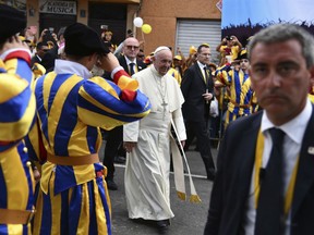 Pope Francis walks through the Plaza de Armas, in Trujillo, Peru, Saturday, Jan. 20, 2018. Francis consoled Peruvians who lost their homes and livelihoods in devastating floods last year, telling them Saturday they can overcome all of life's "storms" by coming together as a community and stamping out the violence that plagues this part of the country.