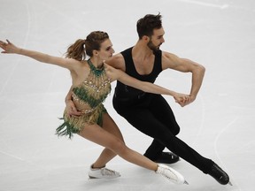 Gabriella Papadakis and Guillaume Cizeron of France perform their short program in the ice dance event at the European figure skating championships in Moscow, Russia, Friday, Jan. 19, 2018.