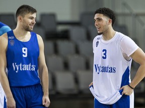 LaMelo Ball, right, talks to a teammate during a training session in Prienai, Lithuania, on Friday, Jan. 5, 2018.  LiAngelo and LaMelo Ball have signed a one-year contract to play for Lithuanian professional basketball club Prienai - Birstonas Vytautas, in the southern Lithuania town of Prienai, some 110 km from the Lithuanian capital Vilnius.