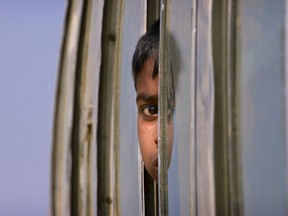 A Rohingya refugee boy who is among those being relocated from a camp near the Bangladesh Myanmar border looks out from the window of a bus as is brought to the Balukhali refugee camp, 50 kilometres (32 miles) from, Cox's Bazar, Bangladesh, Thursday, Jan. 18, 2018. Bangladesh and Myanmar have agreed that they will try to complete the repatriation of hundreds of thousands of Rohingya Muslim refugees who fled from violence in Myanmar within two years, Bangladesh's Foreign Ministry said.