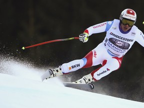 Beat Feuz of Switzerland speeds down the course during alpine ski, men's World Cup downhill, in Garmisch-Partenkirchen, Germany, Saturday, Jan. 27, 2018.