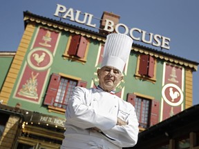 FILE - In this March 24, 2011 file French Chef Paul Bocuse poses outside his famed Michelin three-star restaurant L'Auberge du Pont de Collonges in Collonges-au-Mont-d'or, central France. French interior minister announces Saturday Jan.20, 2018 that Paul Bocuse, a master of French cuisine, has died at 91.
