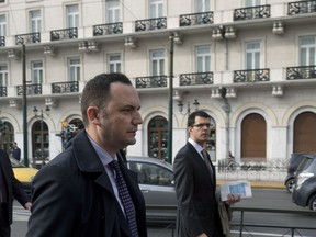 Deputy Prime Minister of Macedonia Bujar Osmani center, arrives for a meeting with Greek Alternate Minister of Foreign Affairs George Katrougalos in Athens, Greece, on Tuesday, Jan. 9, 2018. Osmani is in Greece as the two countries have agreed to resume efforts to try and resolve a long-standing name dispute that began after the tiny Balkan republic gained independence from Yugoslavia.