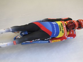 Germany's Toni Eggert and Sascha Benecken speed down the track during a men's double race at the Luge World Cup event in Sigulda, Latvia, Saturday, Jan. 27, 2018. Eggert and Benecken won the event.