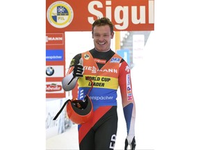 Germany's Felix Loch celebrates after taking second place in a men's race at the Luge World Cup event in Sigulda, Latvia, Sunday, Jan. 28, 2018.