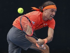 Alexandr Dolgopolov of Ukraine plays a backhand to Fabio Fognini of Italy during their men's singles match at the Sydney International tennis tournament in Sydney, Wednesday, Jan. 10, 2018.