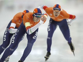 Jan Blokhuijen, Simon Schouten, Marcel Bosker, of Netherlands, from left to right, skate in the men's team pursuit during the European Speed Skating Championship in Kolomna, Russia, Sunday, Jan. 7, 2018.
