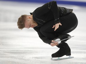 Phillip Harris, of Britain, skates during his short program at the European figure skating championships in Moscow, Russia, Wednesday, Jan. 17, 2018.