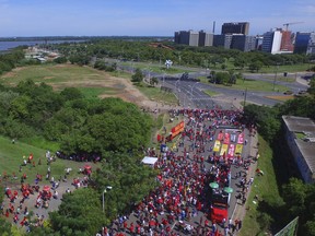 Supporters of ex-President Luiz Inacio Lula da Silva gather near the Federal Regional Court, where a three-member court is considering whether to uphold or throw out a corruption conviction against da Silva, in Porto Alegre, Brazil, Wednesday, Jan. 24, 2018. The decision could impact whether the former leader can run for president. The 72-year-old leads preference polls for October's race.