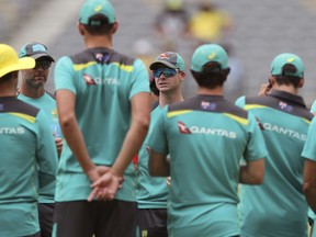 Australia's Steven Smith, center, talks to his players during their warm up before their one day international cricket match against England in Perth, Australia, Sunday, Jan. 28, 2018.