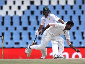 India's bowler Jasprit Bumrah, front, fields off his own bowling as South Africa's batsman AB de Villiers watches, on the fourth day of the second cricket Test match between South Africa and India at Centurion Park in Pretoria, South Africa, Tuesday, Jan. 16, 2018.