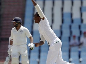 South Africa's bowler Kagiso Rabada, right, celebrates the wicket of India's batsman Parthiv Patel, left, on the fifth and final day of the second cricket test match between South Africa and India at Centurion Park in Pretoria, South Africa, Wednesday, Jan. 17, 2018.