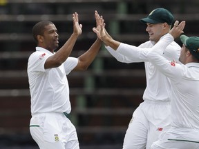 South Africa's bowler Vernon Philander‚ left, celebrates with teammates after dismissing India's batsman Murali Vijay, for 6 runs on the first day of the third cricket test match between South Africa and India at the Wanderers Stadium in Johannesburg, South Africa, Wednesday, Jan. 24, 2018.