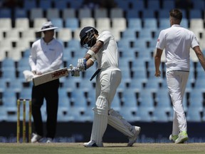 India's captain Virat Kohli, center, reacts after being dismissed by South Africa's bowler Morne Morkel‚ right, for 153 runs during the third day of the second cricket test match between South Africa and India at Centurion Park in Pretoria, South Africa, Monday, Jan. 15, 2018.