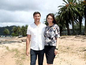 Prime Minister Jacinda Ardern poses with her partner Clarke Gayford on February 4, 2018 in Waitangi, New Zealand. Ardern and Gayford are expecting their first child in June 2018.