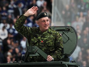 Retired Toronto Maple Leafs player Dave "Tiger" Williams salutes the crowd on military honour night prior to a game between the Winnipeg Jets and the Toronto Maple Leafs on March 16, 2013 at the Air Canada Centre in Toronto, Ontario, Canada.