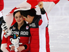 Tessa Virtue and Scott Moir celebrate Canada’s figure skating team event gold medal.