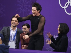 Scott Moir and Tessa Virtue with coaches Marie-France Dubreuil and Patrice Lauzon.