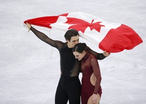 Tessa Virtue and Scott Moir celebrate their gold in the Olympic ice dance.