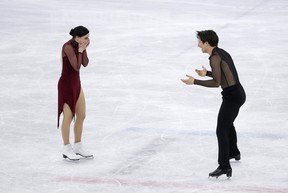 Tessa Virtue and Scott Moir celebrate their gold medal win.