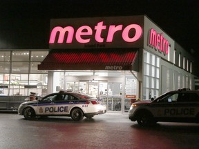 Police at the scene of a shooting on Wellington Street West on Sunday, February 25, 2018. (Patrick Doyle) ORG XMIT: 0226 shooting 05