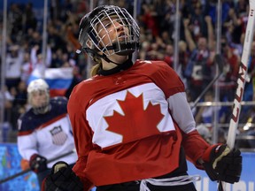 In this Feb. 12, 2014 file photo, Canada's Meghan Agosta celebrates her goal against the U.S. at the Sochi Olympics.