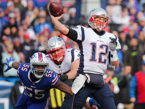 Jerry Hughes of the Buffalo Bills attempts to sack Tom Brady of the New England Patriots on Dec. 3, 2017.