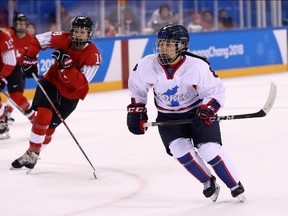Selin Kim of the Korean women's hockey team skates against Switzerland during Saturday's tournament opener for both teams at Kwandong Hockey Centre.