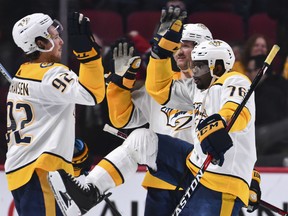 P.K. Subban of the Nashville Predators celebrates a victory over the Canadiens with teammate Ryan Johansen  at the Bell Centre in Montreal on Saturday night. The Predators won 3-2 in a shootout.