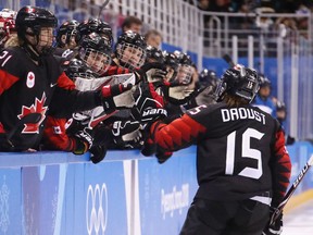 Melodie Daoust celebrates with her Canadian teammates after scoring a goal in the second period against Finland.