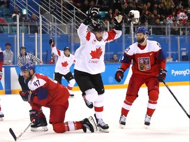 Team captain Chris Kelly and Canada, bronze in men's hockey.