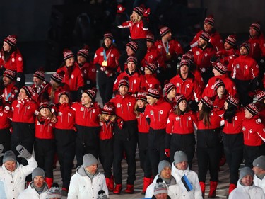 Canadian Olympic athletes march in the athletes march during the closing ceremony of the PyeongChang 2018 Olympic Winter Games at the PyeongChang Olympic Stadium, February 25, 2018.   Photo by Jean Levac/Postmedia